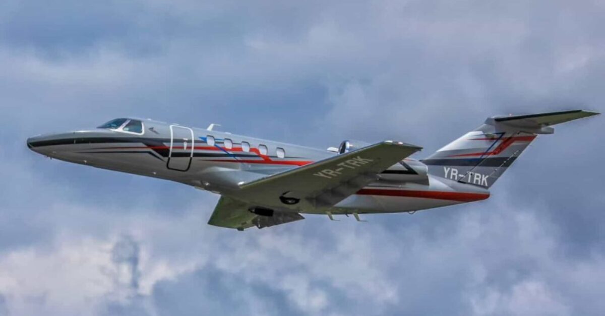 An image of a Toyo Aviation jet flying in the sky