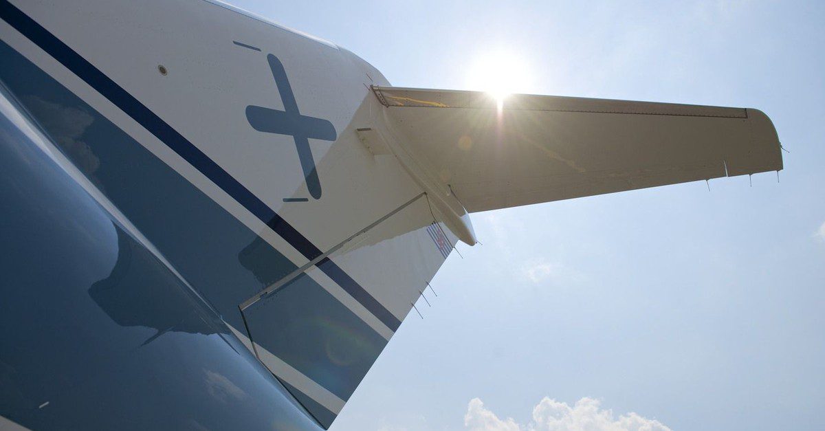 The tail of a LuxAviation aircraft